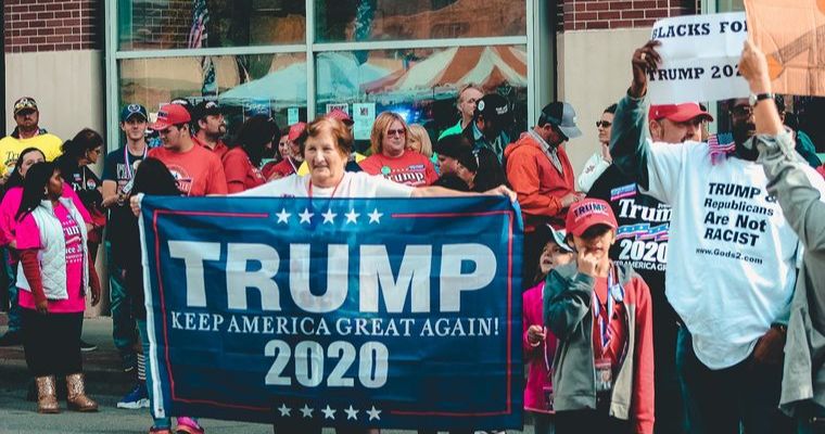 People protesting for keeping America…