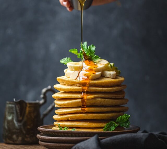 Sweet Delight: Drizzling honey over…
